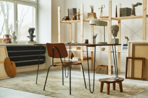 Unique,Artist,Workspace,Interior,With,Stylish,Desk,,Wooden,Easel,,Bookcase,
