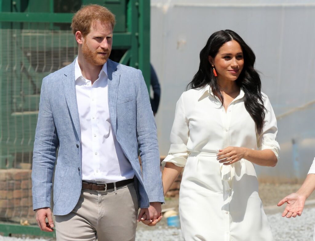 JOHANNESBURG, SOUTH AFRICA - OCTOBER 02: Prince Harry, Duke of Sussex and Meghan, Duchess of Sussex visit a township to learn about Youth Employment Services on October 02, 2019
