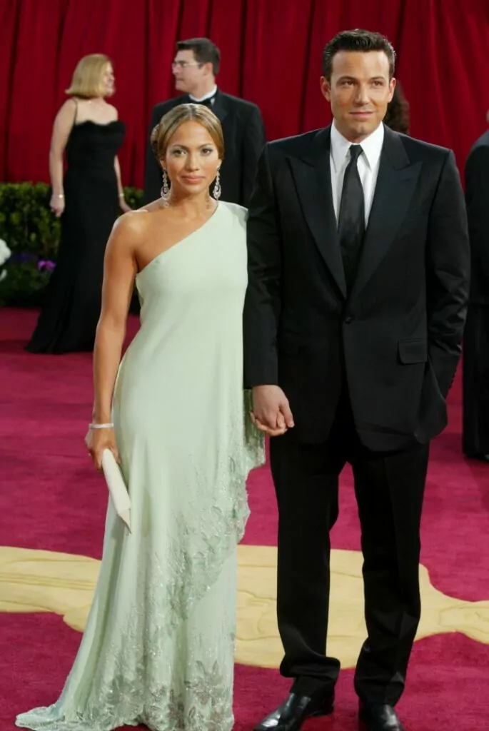 HOLLYWOOD - MARCH 23: Actors Ben Affleck and fiancee Jennifer Lopez, wearing Harry Winston jewelry, attends the 75th Annual Academy Awards at the Kodak Theater on March 23, 2003 in Hollywood, California. (Photo by Kevin Winter/Getty Images)