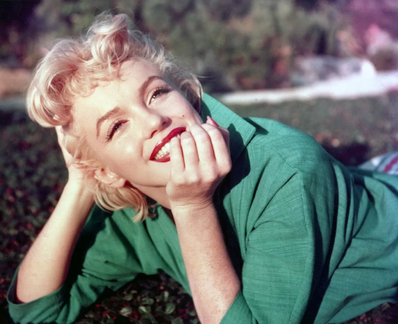 PALM SPRINGS, CA - 1954: Actress Marilyn Monroe poses for a portrait laying on the grass in 1954 in Palm Springs, California. (Photo by Baron/Hulton Archive/Getty Images)