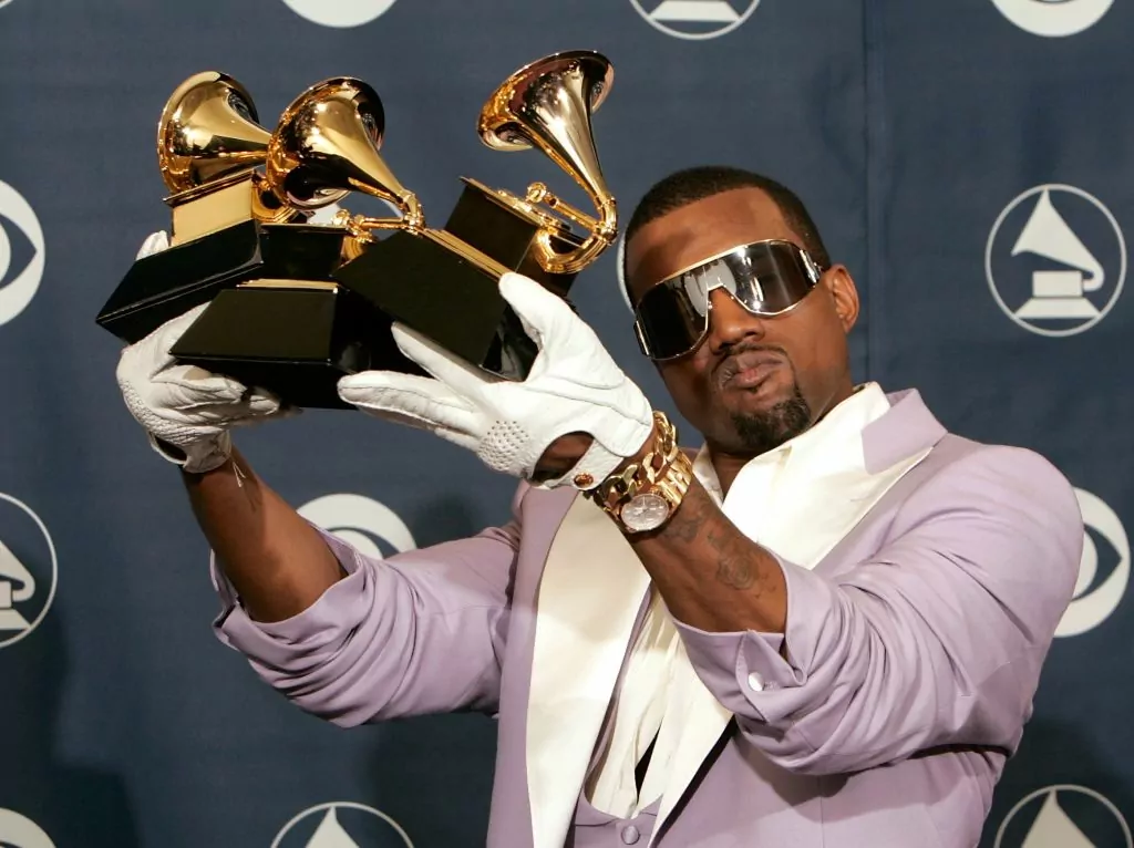 LOS ANGELES, CA - FEBRUARY 08: Singer Kanye West poses with his Best Rap Song, Best Rap Solo Performance and Best Rap Album awards in the press room at the 48th Annual Grammy Awards at the Staples Center on February 8, 2006 in Los Angeles, California. (Photo by Kevin Winter/Getty Images)