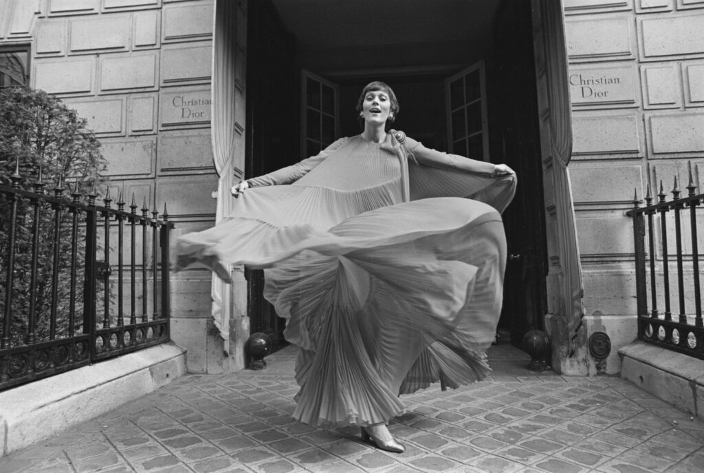 A fashion model wearing a chiffon evening gown by Christian Dior, UK, 30th July 1971. (Photo by Reg Lancaster/Daily Express/Getty Images)