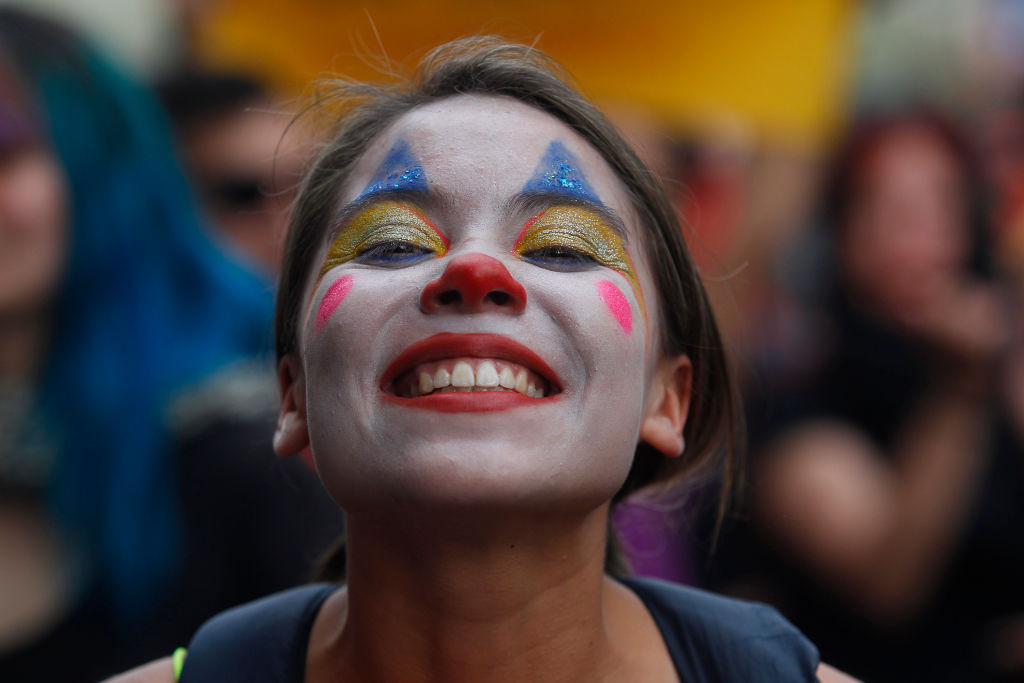 SANTIAGO, CHILE - OCTOBER 25: A woman make up as a clown poses during the eighth day of protests against President Sebastian Piñera's government on October 25, 2019 in Santiago, Chile. President Sebastian Piñera announced measures to improve social inequality, however unions called for a nationwide strike and massive demonstrations continue as death toll reached 18. Demands behind the protests include issues as health care, pension system, privatization of water, public transport, education, social mobility and corruption. (Photo by Marcelo Hernandez/Getty Images)