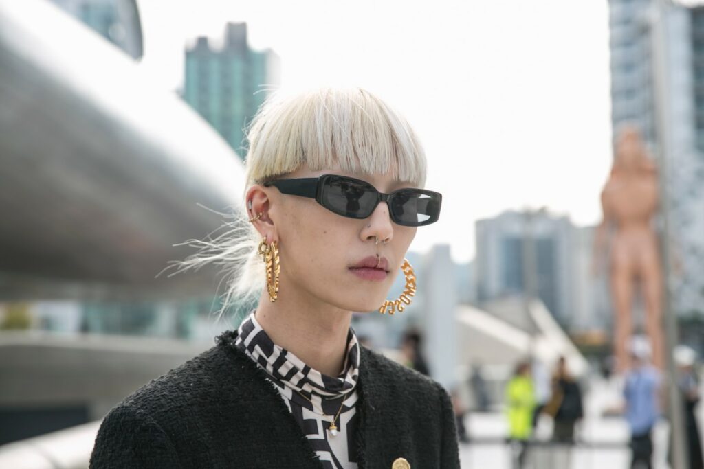 SEOUL, SOUTH KOREA - OCTOBER 17: A guest is seen wearing Moschino earrings, black blazer and a black fanny bag during the Seoul Fashion Week 2020 S/S at Dongdaemun Design Plaza on October 17, 2019 in Seoul, South Korea. (Photo by Jean Chung/Getty Images)