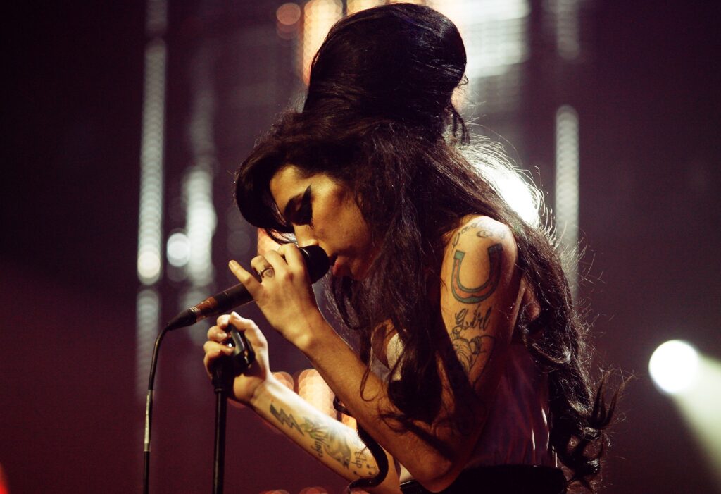 LONDON - SEPTEMBER 19: Singer Amy Winehouse performs at the Music of Black Origin Awards (MOBO) at the O2 Arena Greenwich on September 19, 2007 in London, England. (Photo by Jo Hale/Getty Images)