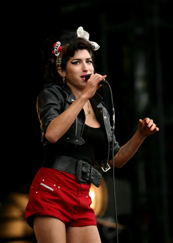 KINROSS, UNITED KINGDOM - JULY 13: Singer Amy Winehouse performs during day three of T In The Park Festival 2008 at Balado July 13, 2008 in Kinross, Scotland. (Photo by Graham Denholm/Getty Images)