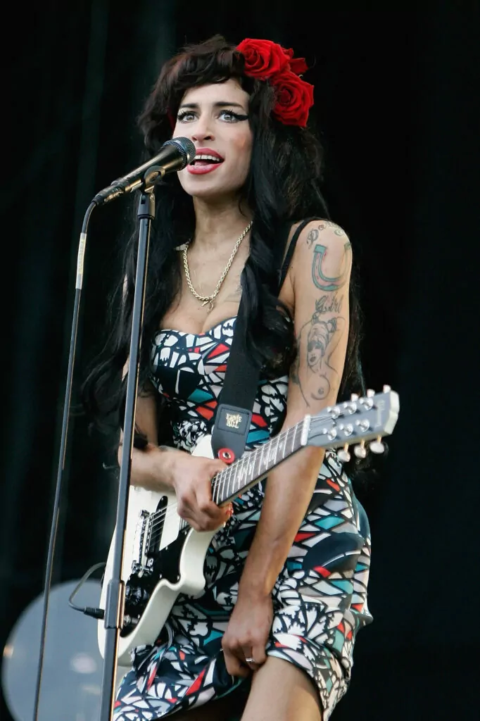 CHELMSFORD, UNITED KINGDOM - AUGUST 17: Amy Winehouse performs live on the V stage during Day Two of V Festival 2008 at Hylands Park on August 17, 2008 in Chelmsford, England. (Photo by Simone Joyner/Getty Images)