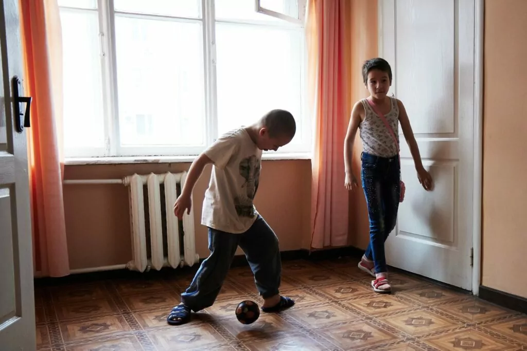 NOVOCHERKASSK, RUSSIA - FEBRUARY 25: Refugee children from the self-proclaimed Donetsk People's Republic play at the temporary accommodation on February 25, 2022 in Novocherkassk, 40 km. north from Rostov-on-Don, Russia. Refugees continued to arrive in Rostov Oblast as Russia furthered its wide-ranging attack on Ukraine, with Russian troops invading the country from the north, south and east, where two breakaway regions had been held by separatist forces since 2014. (Photo by Oleg Nikishin/Getty Images)