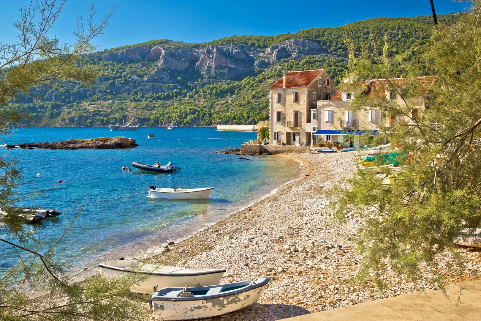 Paradise beach in Komiza adriatic village on Vis island, Dalmatia, Croatia