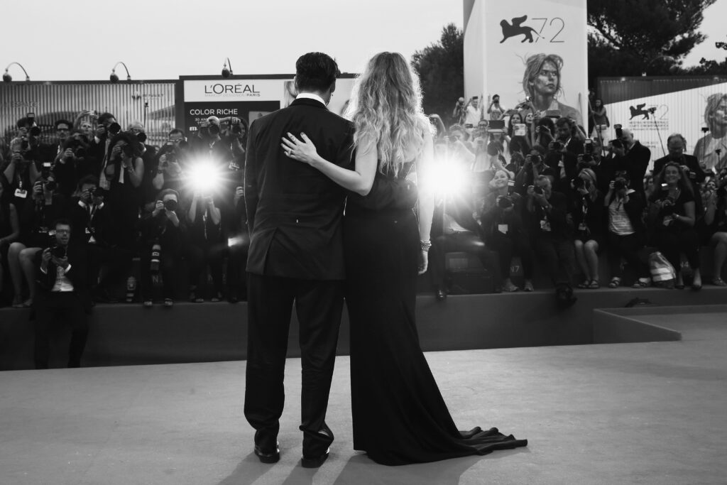 VENICE, ITALY - SEPTEMBER 03: (EDITORS NOTE: Image has been converted to black and white)Johnny Depp and Amber Heard attend a premiere for 'Black Mass' during the 72nd Venice Film Festival on September 4, 2015 in Venice, Italy. (Photo by Vittorio Zunino Celotto/Getty Images)