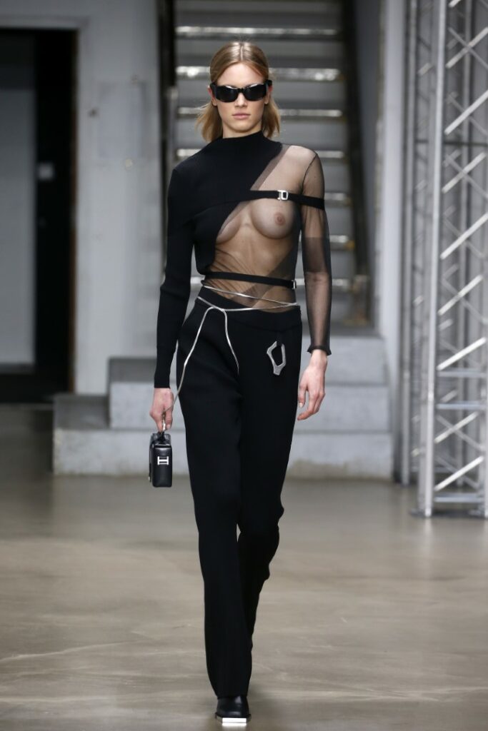 PARIS, FRANCE - MARCH 03: (EDITORS NOTE: Image contains nudity). (EDITORIAL USE ONLY - For Non-Editorial use please seek approval from Fashion House) A model walks the runway during the Heliot Emil Womenswear Fall/Winter 2022-2023 show as part of Paris Fashion Week at Palais de Tokyo on March 03, 2022 in Paris, France. (Photo by Thierry Chesnot/Getty Images)
