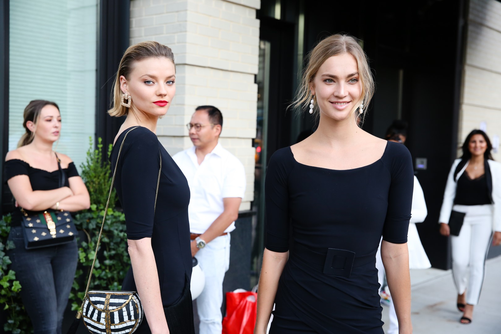 NEW YORK, NEW YORK - SEPTEMBER 07: Two guests wearing black dresses during New York Fashion Week at Spring Studios on September 07, 2019 in New York City. (Photo by Donell Woodson/Getty Images)
